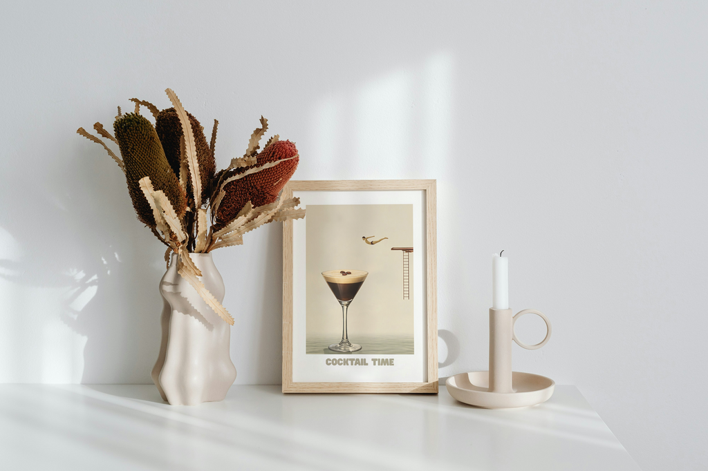 Surreal cocktail art print poster featuring a diver jumping into an espresso martini glass in warm neutral tones for modern kitchen or bar decor