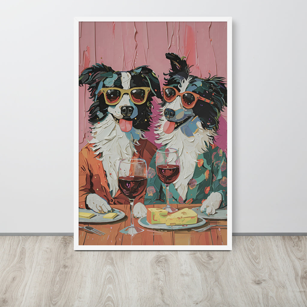 Cafe wall art print depicting two dogs in sunglasses sitting at a table with wine glasses and cheese, displayed against a light wall on a light wood floor.