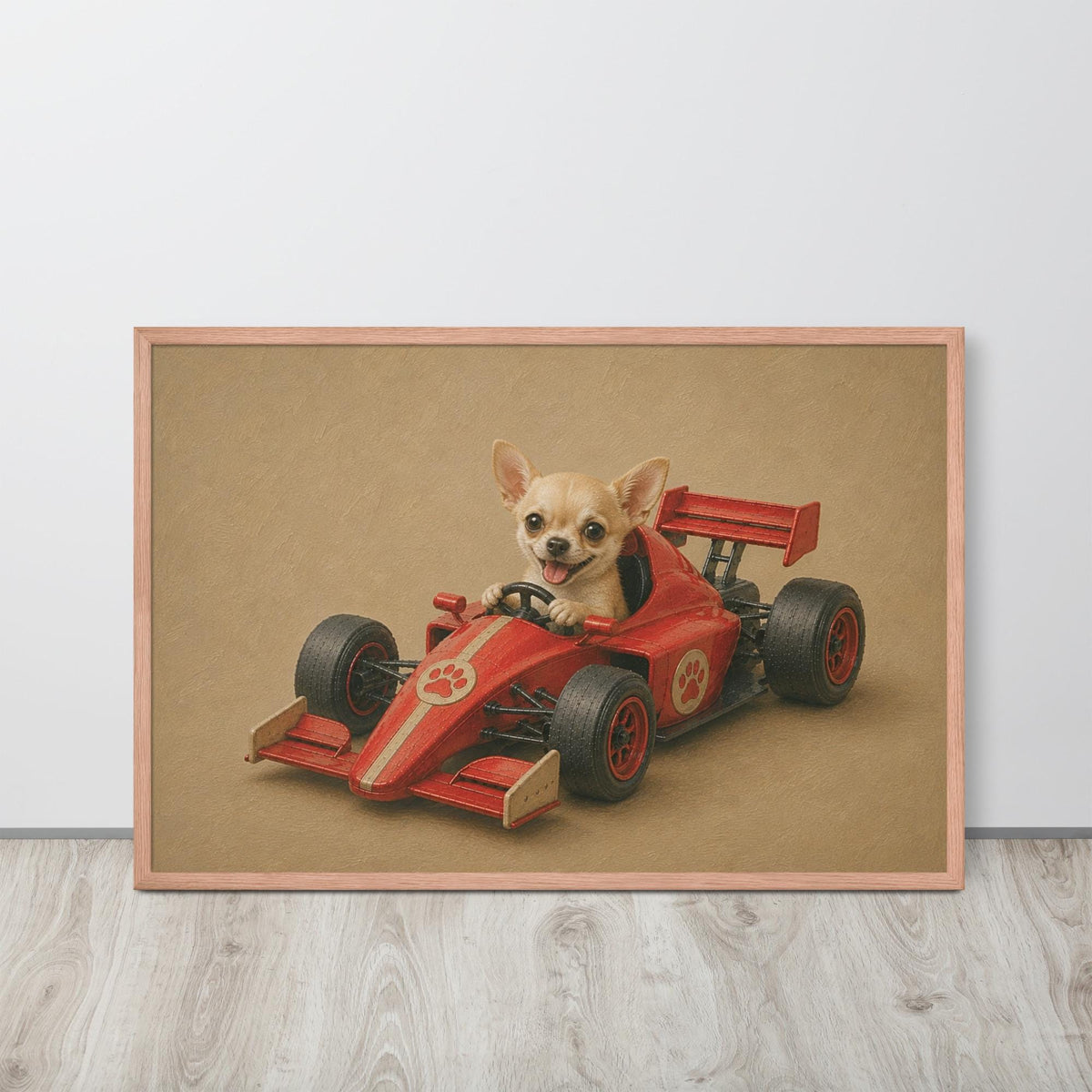 A framed chihuahua do wall art print featuring a small chihuahua dog sitting in a red race car, displayed on a light wood floor against a white wall.
