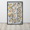 Oyster wall art print featuring a top-down photograph of raw oysters on ice with lemon slices, displayed against a light wall on a light wood floor.