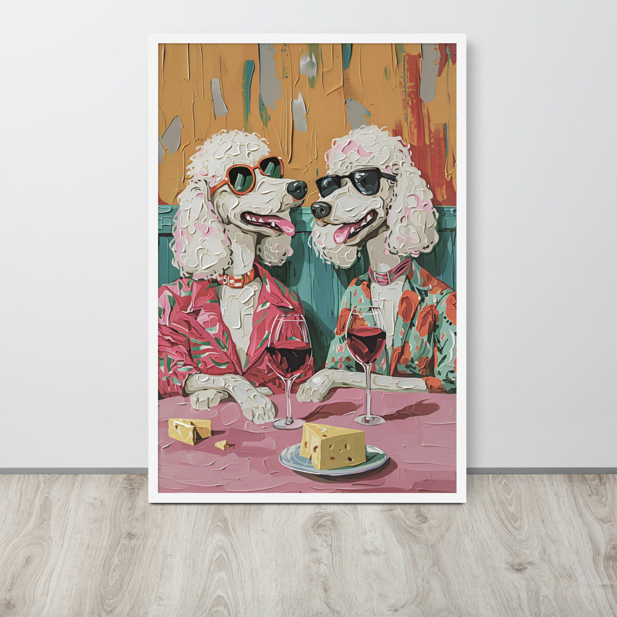 Funny dining room wall art print featuring a stylized painting of two poodles wearing sunglasses and suits, seated at a table with cheese and wine glasses, displayed against a light gray wall on a wood floor.