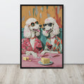 Funny poodle art print depicting two poodles in stylish sunglasses and colourful suits sitting at a table with cheese and wine glasses, shown leaning against a white wall on a light wood floor.