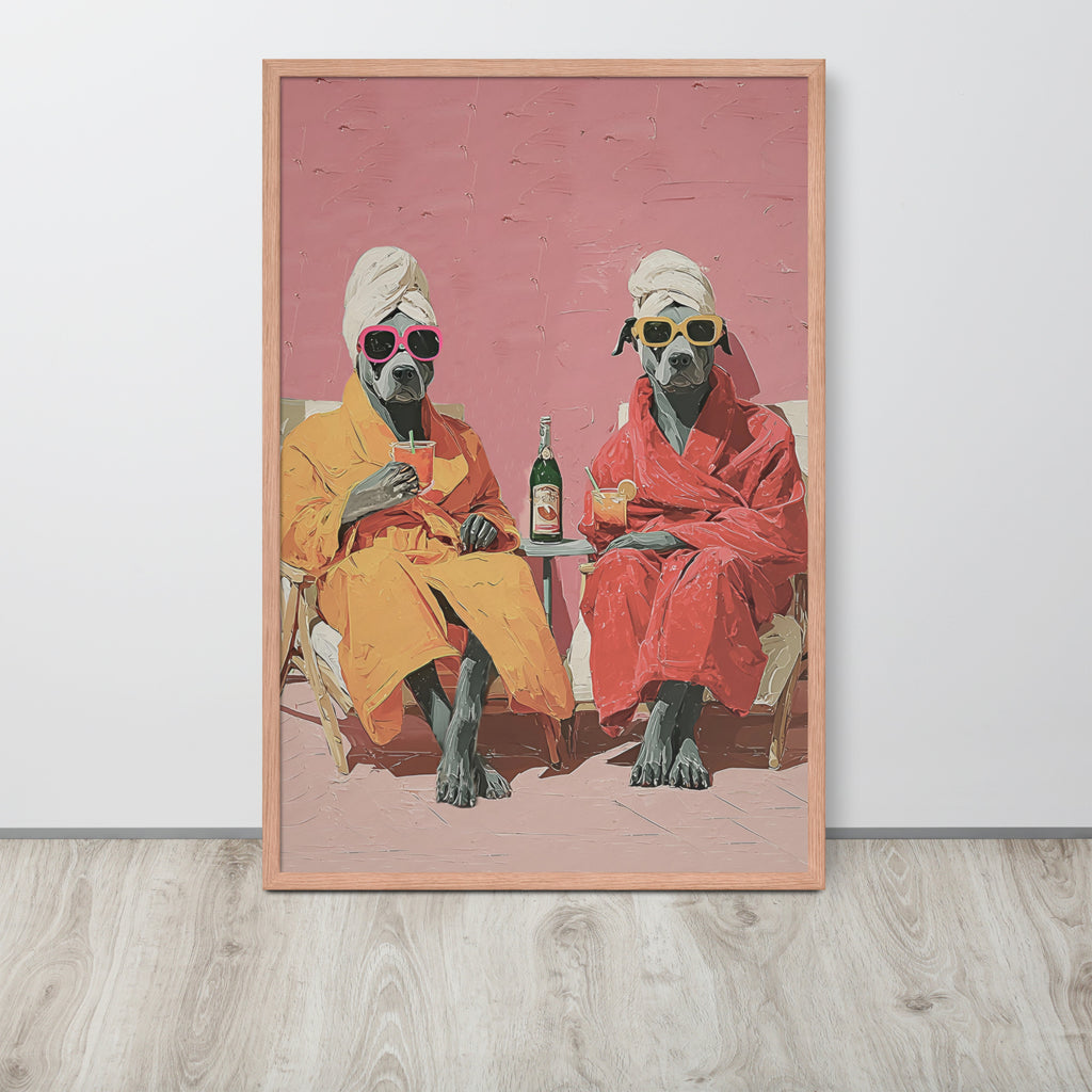 Funny staffy dog art print featuring a whimsical illustration of two staffy dogs in orange and red robes sitting in chairs, wearing towels and sunglasses, with a bottle between them, displayed against a light gray wall on a wood floor.