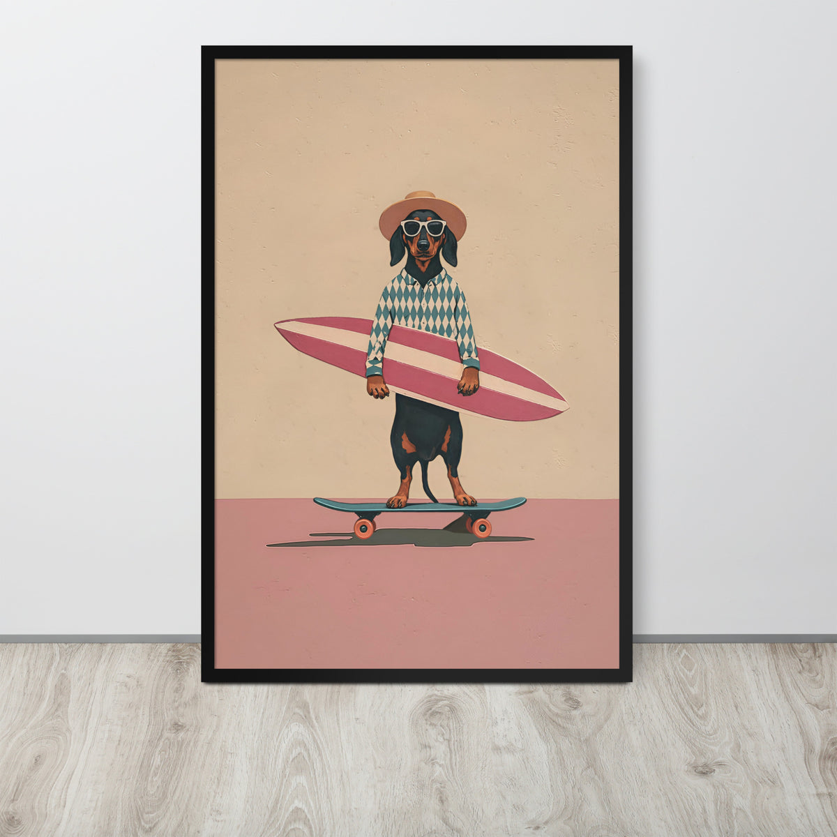 Surfing dachshund wall art print featuring a dachshund wearing sunglasses and a hat, holding a pink surfboard while skateboarding on a pink ground against a beige background. The print is displayed on a light gray wall above a light wood floor.