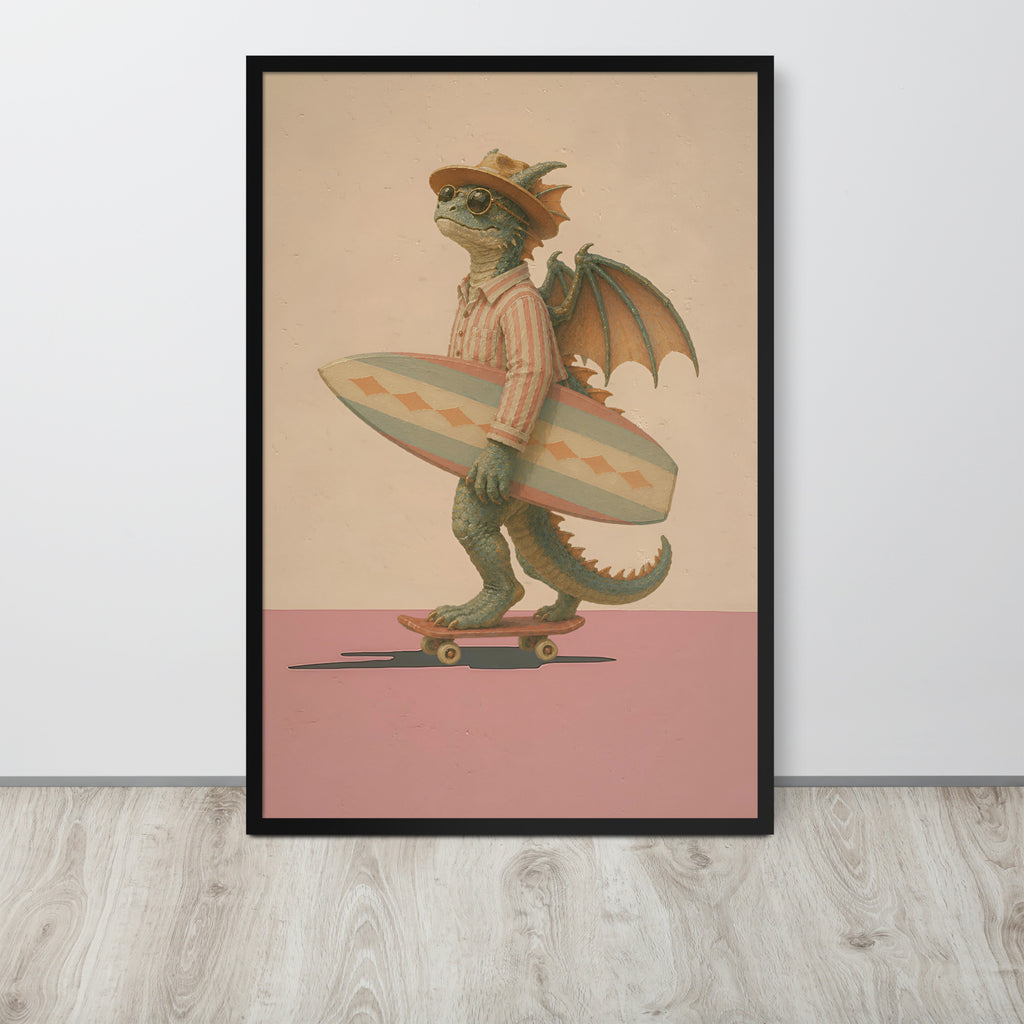 A framed vintage fantasy wall art print leaning against a white wall on a light wood floor. The print shows a green dragon wearing a hat and striped shirt, holding a surfboard while riding a skateboard, with a beige background and pink lower section.