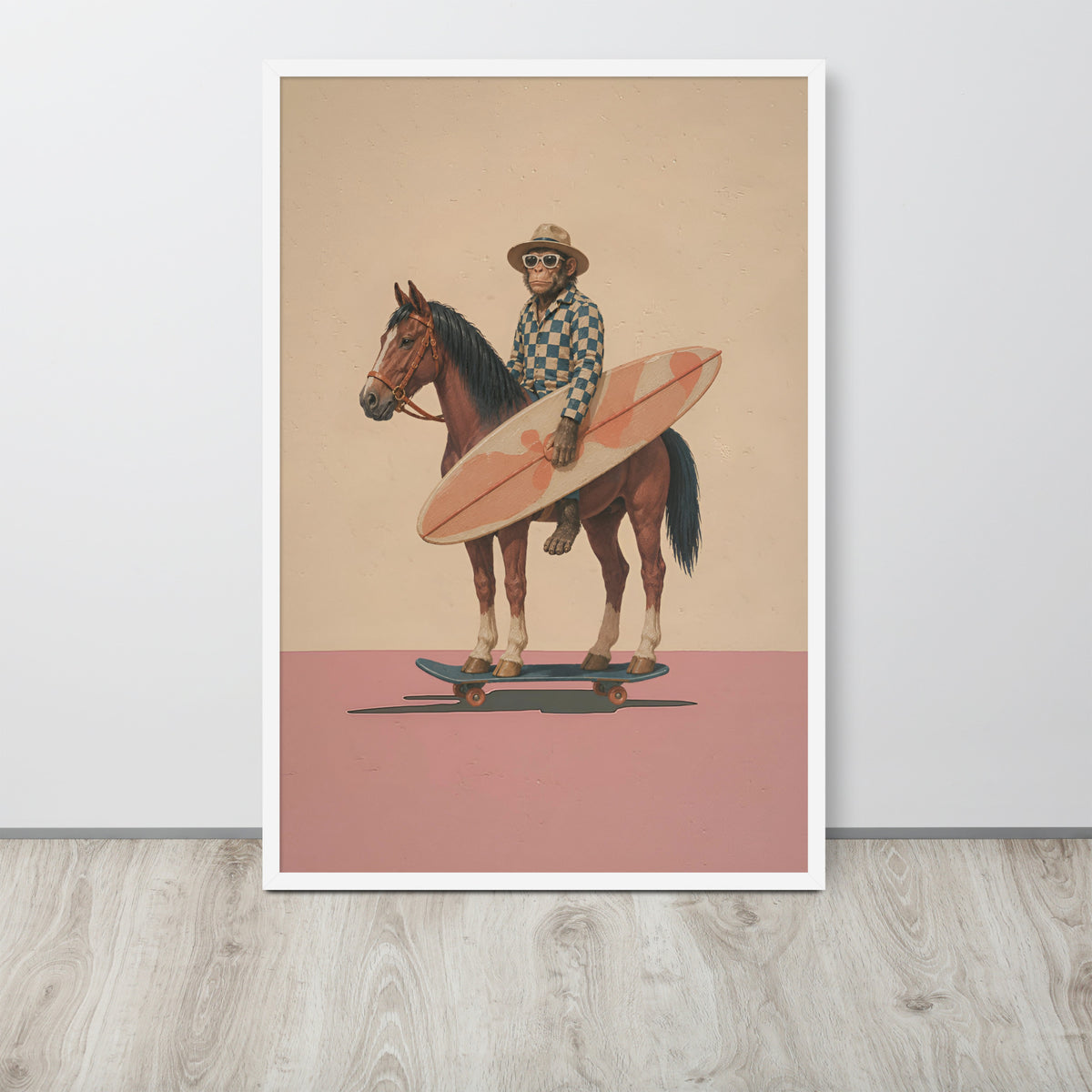 Whinsical surreal wall art print leaning against a light gray wall on a light wood floor. The print shows a surreal illustration of a monkey in a hat and sunglasses riding a brown horse while holding a pink surfboard, with a beige upper background and a pink lower background.