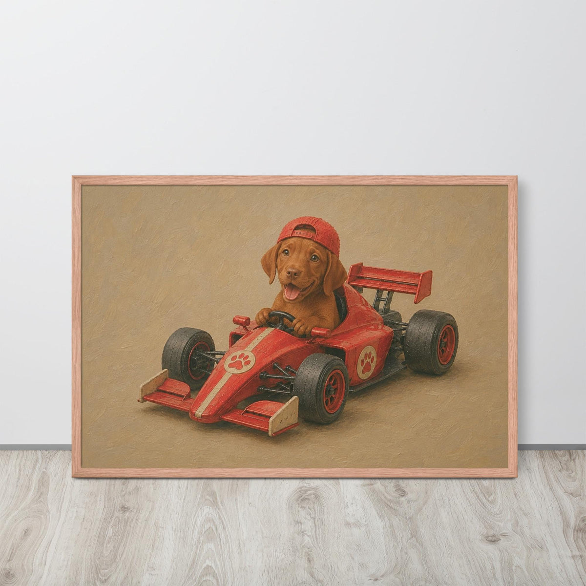 A framed vizsla dog wall art print featuring a brown dog wearing a red racing helmet and driving a red race car, displayed on a light gray wall above a light wood floor.